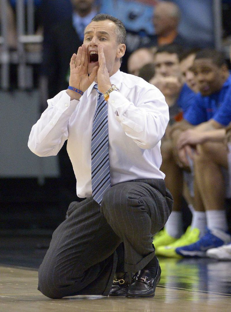 Florida coach Billy Donovan yells at this team during the first half in a third-round game in the NCAA college basketball tournament against Pittsburgh Saturday, March 22, 2014, in Orlando, Fla. (AP Photo/Phelan M. Ebenhack)