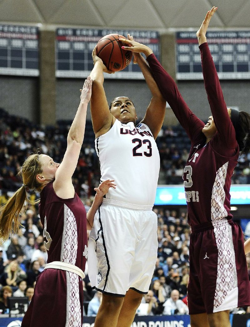 Connecticut’s Kaleena Mosqueda-Lewis (23) scored 20 points, grabbed 10 rebounds and had 10 assists to lead the Huskies to a 91-52 victory over Saint Joseph’s on Tuesday in the second round of the NCAA Tournament in Storrs, Conn. 