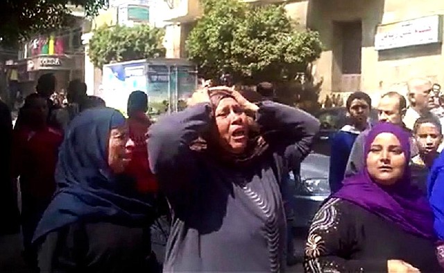 This image made from video shows relatives reacting after an Egyptian court on Monday sentenced to death 529 supporters of ousted Islamist President Mohammed Morsi in connection with an attack on a police station that killed a senior police officer in Minya, Egypt.

