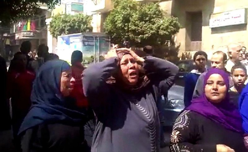 This image made from video shows relatives reacting after an Egyptian court on Monday sentenced to death 529 supporters of ousted Islamist President Mohammed Morsi in connection with an attack on a police station that killed a senior police officer in Minya, Egypt.

