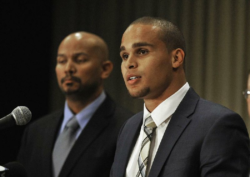 Former Northwestern quarterback Kain Colter (right) speaks while College Athletes Players Association President Ramogi Huma listens during a January news conference. Northwestern players were given the OK on Wednesday to create the nation’s first union of college athletes. 