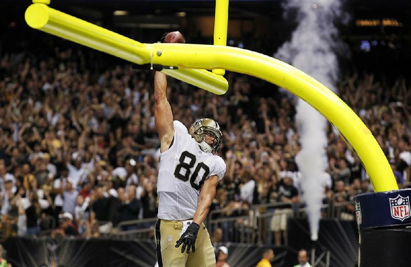 Celebration dunks over the goal-post crossbar, like this one performed by New Orleans Saints tight end Jimmy Graham last season, have been banned by the NFL as part of the league’s effort to improve sportsmanship among its players. 