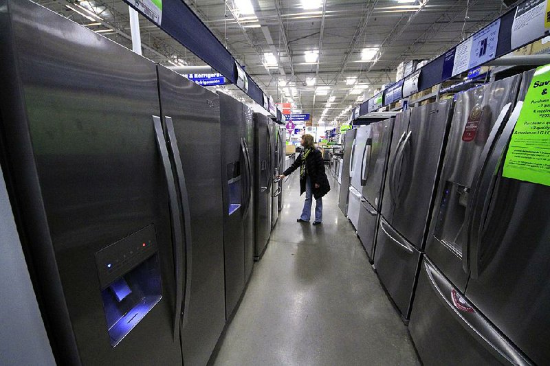 A woman walks through a display of refrigerators at a Lowe’s store in Cranberry Township, Pa., in January. The Commerce Department said Wednesday that orders for durable goods rose 2.2 percent last month after a 1.3 percent drop in January. 