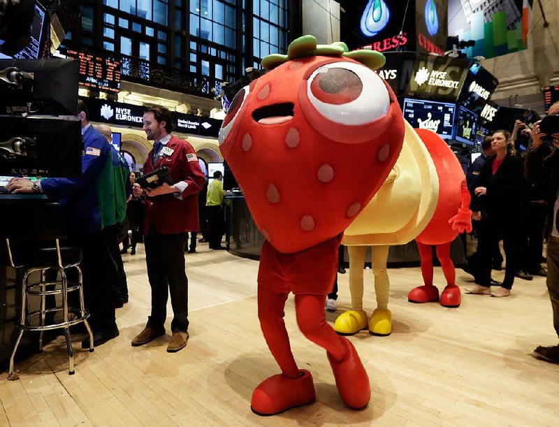 Characters from the King Digital Entertainment game Candy Crush Saga walk the floor of the New York Stock Exchange on Wednesday. 