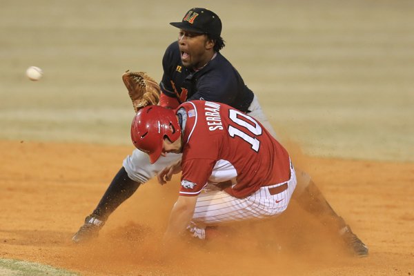 Arkansas' Joe Serrano (10) steals second base as Mississippi Valley's Xzavier Franklin awaits the throw in their game at Dickey-Stephens Park in North Little Rock Wednesday.