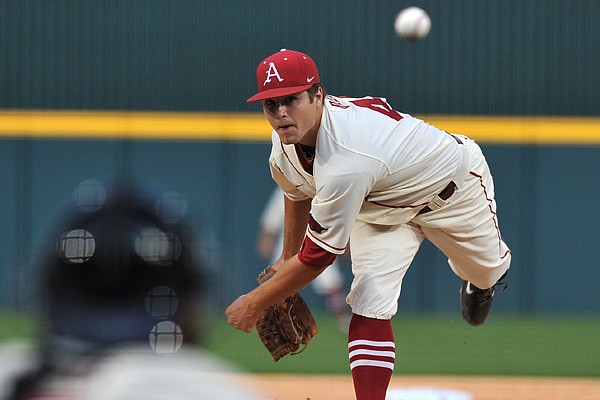 University of Arkansas pitcher Jalen Beeks fires a pitch against Alabama at Baum Stadium in Fayetteville March 21.