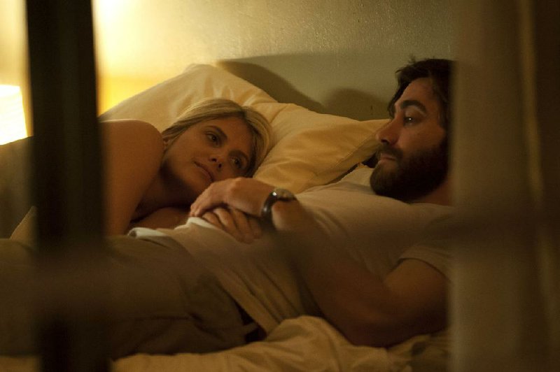 Mary (Melanie Laurent) has to deal with her sad-sack boyfriend Adam (Jake Gyllenhaal) and his oily doppelganger Anthony (also Jake Gyllenhall) in the psychological thriller Enemy, Denis Villeneuve’s freighted exploration of duality and identity. 