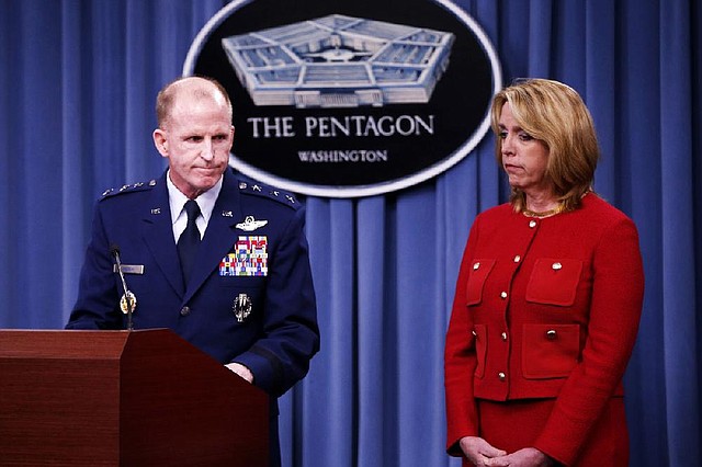 Air Force Secretary Deborah Lee James and Air Force Global Strike Command (AFGSC) Commander Lt. Gen. Stephen Wilson, finish their statements before taking questions during a news conference at the Pentagon, Thursday, March 27, 2014. The Air Force is firing nine mid-level commanders and disciplining dozens of junior officers at a nuclear missile base in response to an exam-cheating scandal that spanned a far longer period than originally reported. (AP Photo/Charles Dharapak)