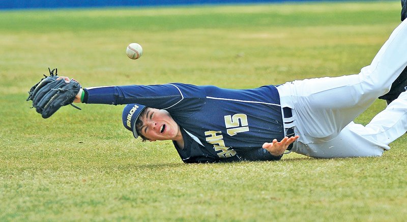 Staff Photo Michael Woods &#8226; @NWAMICHAELW Austin Connolly, Shiloh Christian third baseman, just misses diving after a foul ball Thursday in the first inning against Junction City at Shiloh Christian in Springdale.