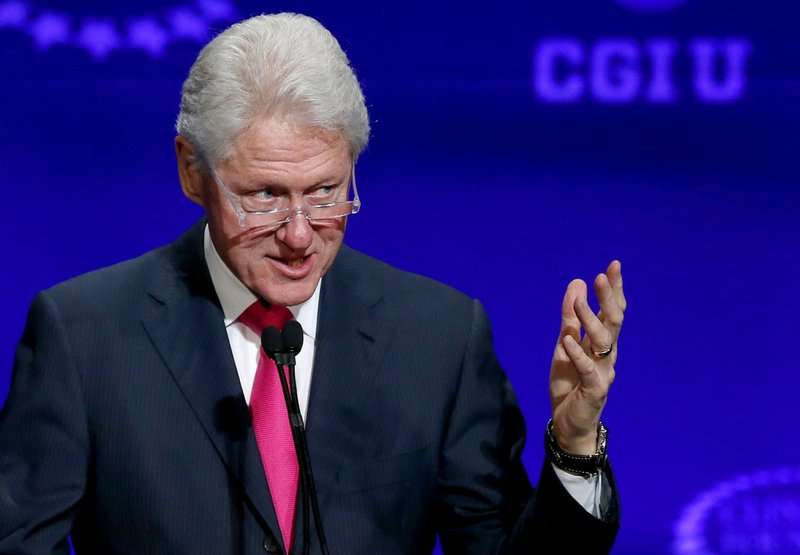 Former president Bill Clinton speaks at a student conference for the Clinton Global Initiative University at Arizona State University, in this March 21, 2014, file photo taken in Tempe, Ariz. 