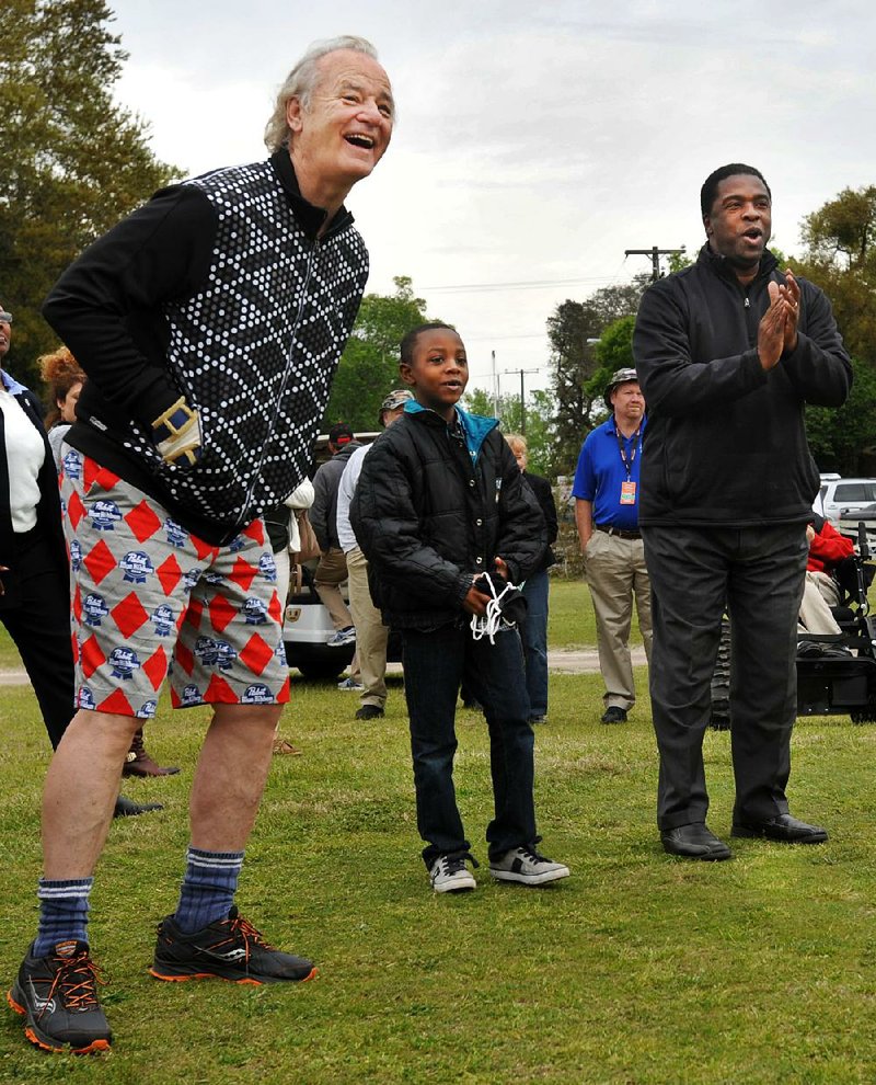 Bill Murray (left) had no problems laughing at his wardrobe Friday during his charity golf tournament in Florida. 