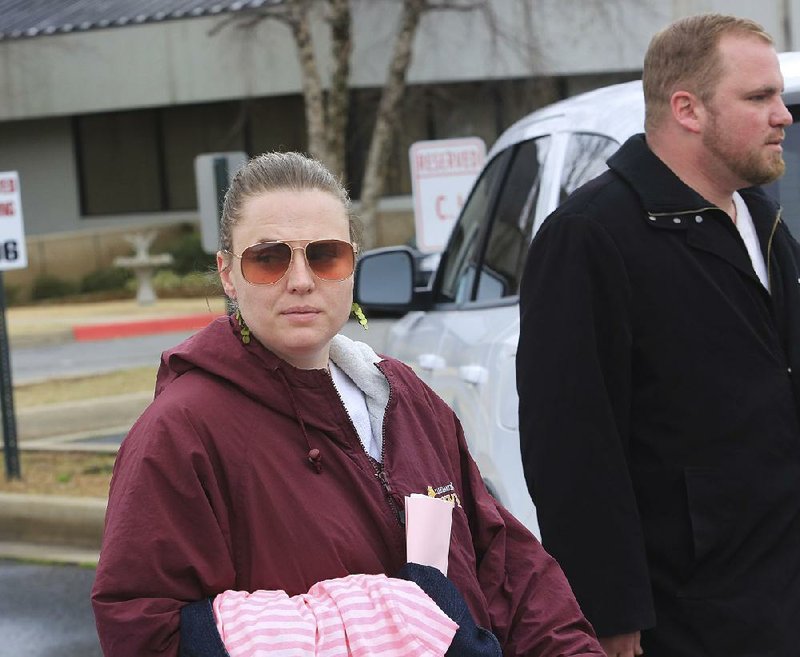 Arkansas Democrat-Gazette/RICK MCFARLAND --03/28/14--  Andrea Davis, 36, and her brother Matthew Davis, 32, leave the Garland County Sheriffs Office after theybonded out in Hot Springs Friday. They were arraigned after being charged with manslaughter in the Feb. 29, 2012 slaying of Maxwell Anderson.