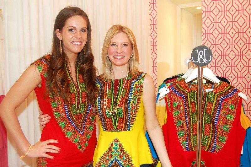 Designer Anna Taylor and Tulips boutique owner Emily Brown show off Taylor’s clothing line, Judith & James, during a recent preview party. The line, made by Kenyan women as part of a training program to empower them, made its second appearance at Mercedes-Benz Fashion Week in New York in February. 