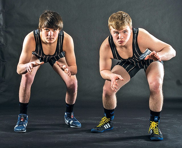 STAFF PHOTO ANTHONY REYES Jeff Bizzle, right, and Aaron Grigsby, both of Bentonville, are the NWA Media Co-Wrestlers of the Year.