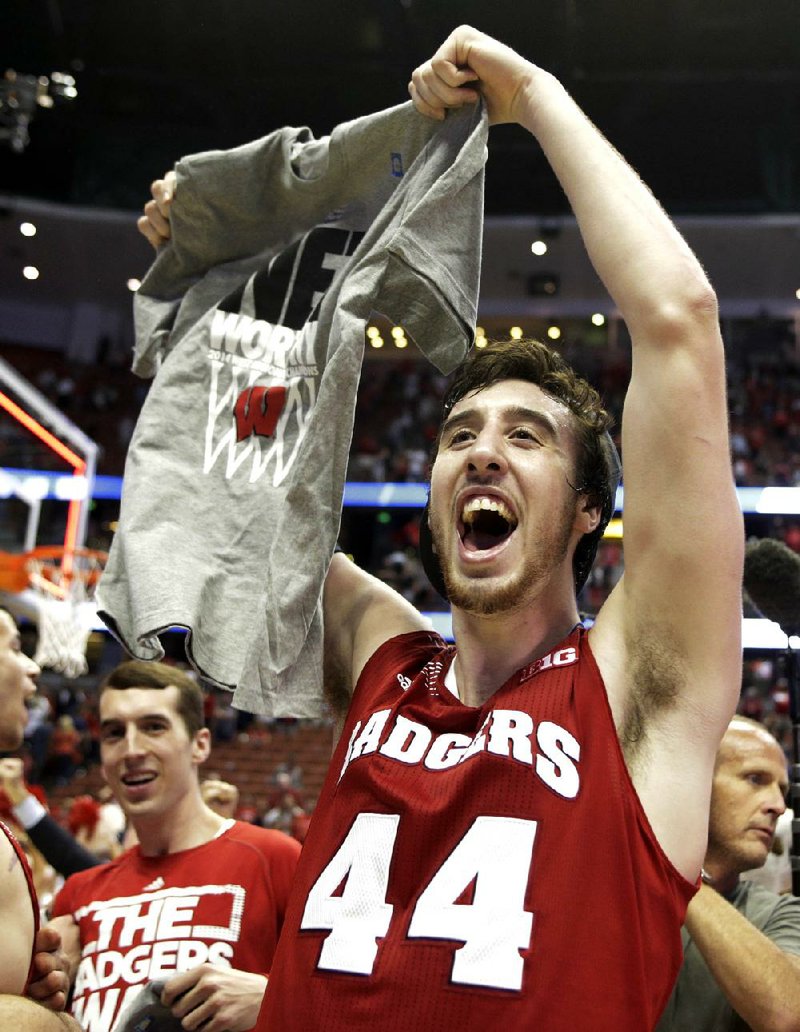 Wisconsin 's Frank Kaminsky celebrates after a regional final NCAA college basketball tournament game against Arizona, Saturday, March 29, 2014, in Anaheim, Calif. Wisconsin won 64-63 in overtime. (AP Photo/Alex Gallardo)