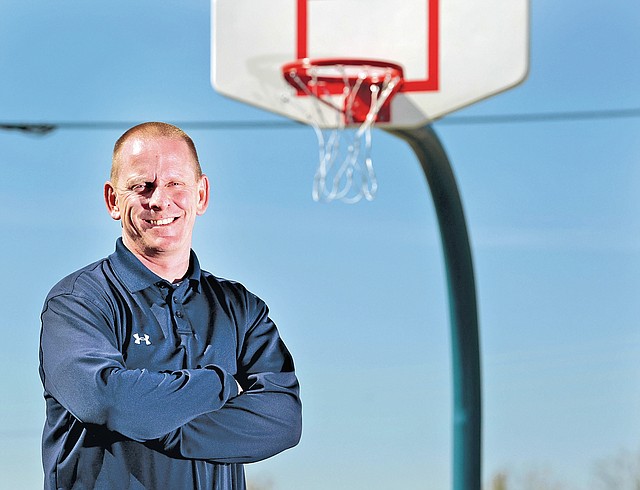  STAFF PHOTO JASON IVESTER Tom Olsen of Rogers Heritage is the All-NWA Media Boys Basketball Coach of the Year.