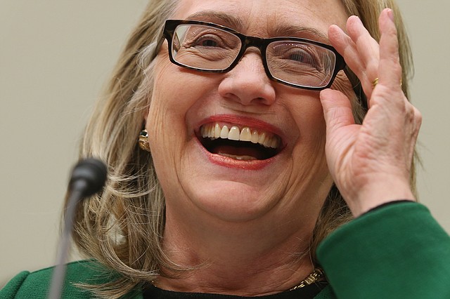 Hillary Clinton reacts during testimony before Congress last year.