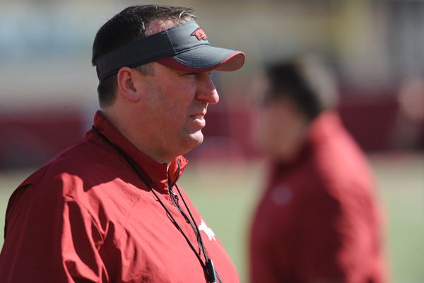 Arkansas coach Bret Bielema watches his team during practice Thursday, March 20, 2014, at the UA practice field in Fayetteville.