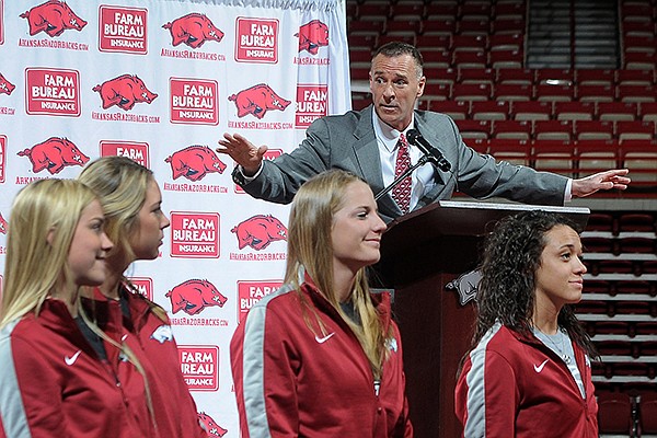 With his team in front of him, Jimmy Dykes speaks after being introduced as the eighth women's head basketball coach Sunday, March 30, 2014, at Bud Walton Arena in Fayetteville. Dykes left his job as an analyst for ESPN for the position. Dykes coached at Arkansas, Sacramento State, Appalachian State, Kentucky and Arkansas-Little Rock, and Oklahoma State.