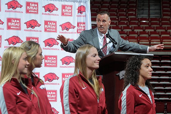 With his team in front of him, Jimmy Dykes speaks after being introduced as the eighth women's head basketball coach Sunday, March 30, 2014, at Bud Walton Arena in Fayetteville. Dykes left his job as an analyst for ESPN for the position. Dykes coached at Arkansas, Sacramento State, Appalachian State, Kentucky and Arkansas-Little Rock, and Oklahoma State.