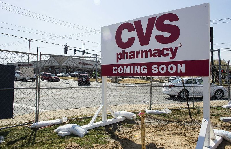 Arkansas Democrat-Gazette/MELISSA SUE GERRITS - 03/26/2014 - BUSINESS STORY Construction on a CVS begins across from a Walgreens at the intersection of Kiehl and 107 in Sherwood March 26, 2014. 