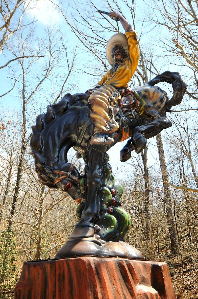 Vaquero, a 16-foot-tall polychrome fiberglass sculpture by Luis Jimenez, stands on the Crystal Bridges Art Trail in Bentonville. The museum won the Arkansas Museum Association’s award for Outstanding Achievement in Conservation for its restoration of the sculpture. 