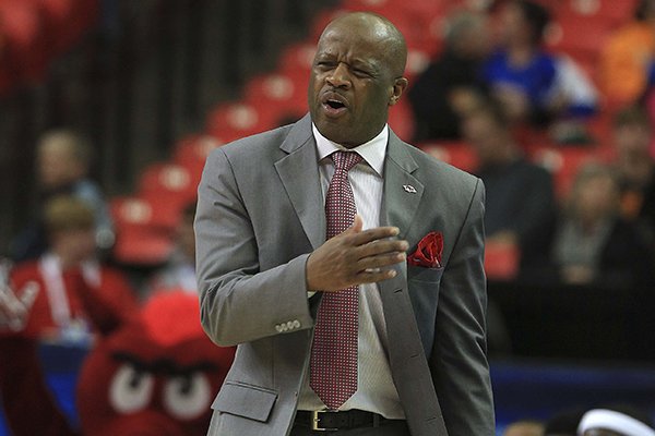 Arkansas coach Mike Anderson yells instruction sot his players Wednesday, March 13, 2014 during their SEC Tournament game at the Georgia Dome in Atlanta.