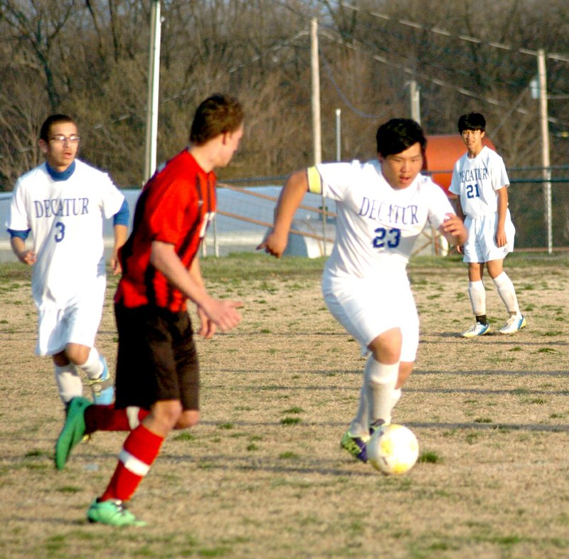 Photo by Mike Eckels Decatur&#8217;s Matt Lee (#23) moves the ball down field during the March 31 match up with Eureka Springs. The Bulldogs defeated the Highlanders, 1 to 0.