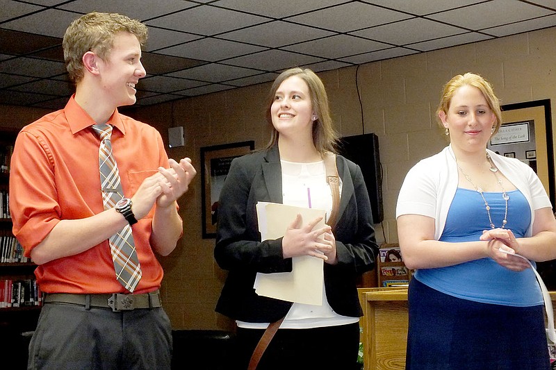 TIMES photograph by Annette Beard Tori Wilkerson, center, and Justin Walls, left, won first place in the Pea Ridge Optimist Club oratorical contest in the girls and boys divisions respectively. Kelsie Boyd, right, won second in the girls&#8217; division. The contest was held Monday, March 24, in the high school library. Wilkerson, 17, is the daughter of Wesley and Shelia Wilkerson. Wall, 16, is the son of Barry and Mechel Wall. Boyd, 18, is the daughter of Marty and Lori Boyd. Wilkerson and Wall will represent Pea Ridge in the Optimist Club district competition.