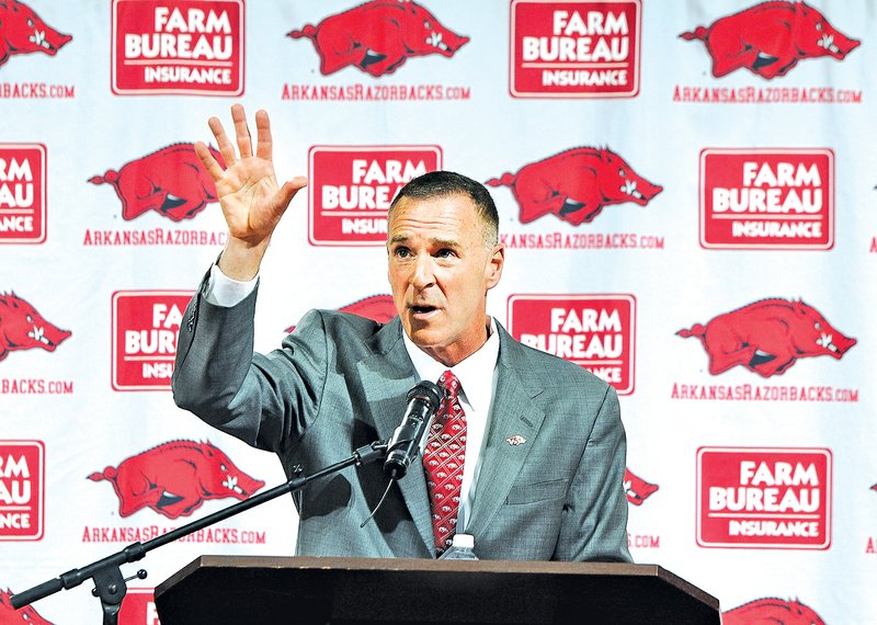  STAFF PHOTO SAMANTHA BAKER • @NWASAMANTHA Jimmy Dykes speaks after being introduced Sunday as the eighth Arkansas women's head basketball coach at Bud Walton Arena in Fayetteville. Dykes left his job as an analyst for ESPN for the position. Dykes coached at Arkansas, Sacramento State, Appalachian State, Kentucky and Arkansas-Little Rock, and Oklahoma State.