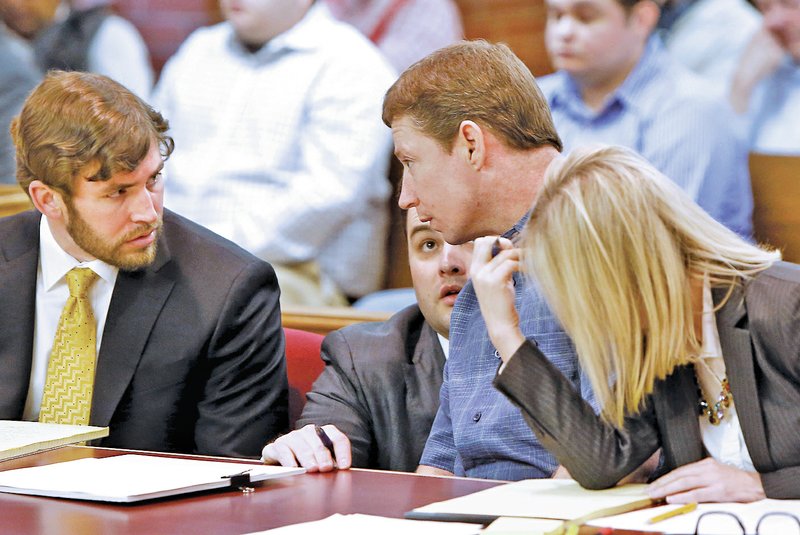 STAFF PHOTO DAVID GOTTSCHALK James Patton, second from right, the last of four Prairie Grove residents accused of beating Ronnie Lee Bradley to death, visits Tuesday with his attorneys, Chris Nebben, left, Drew Ledbetter, second from left, and Courtney Cline in Judge William Storey's courtroom at the Washington County Courthouse in Fayetteville.