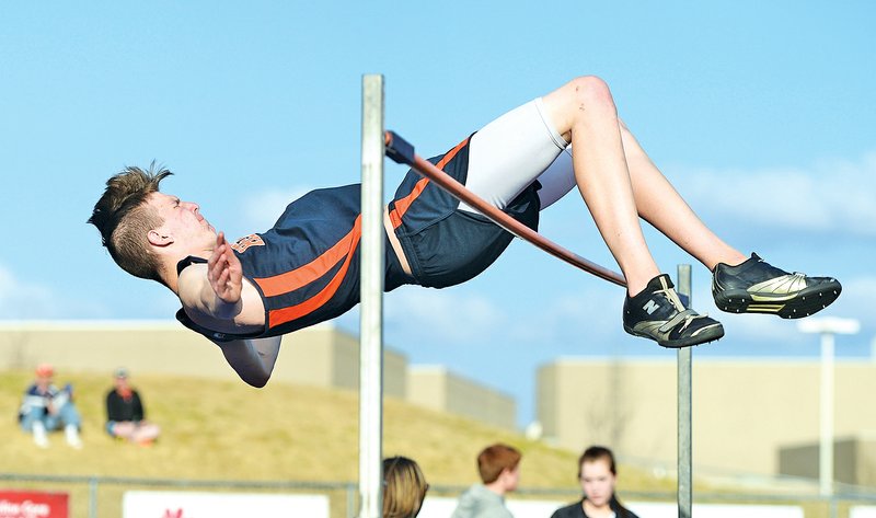 STAFF PHOTO ANTHONY REYES Nate Raines of Rogers Heritage wins the high jump Tuesday with a height of 6'2" in a jump-off during the Whitey Smith Relays Carnival track meet at Whitey Smith Stadium in Rogers.