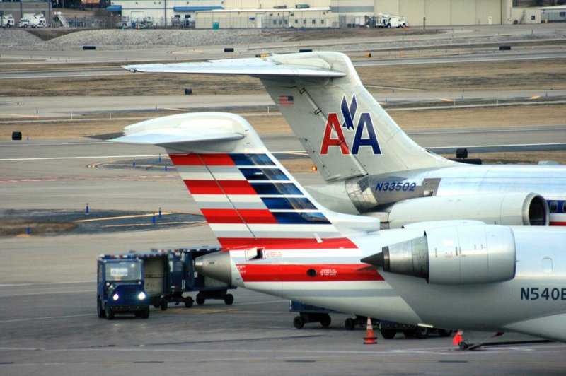 Crews work around two American Airlines jets in St. Louis, in this December 2013 file photo.