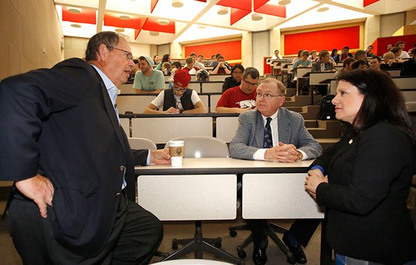 NWA Media/DAVID GOTTSCHALK 
Philip Condit (from left), former chairman and chief executive officer of Boeing Co., visits Wednesday with John A. White, distinguished professor and chancellor emeritus at the University of Arkansas in Fayetteville, and Kim Needy, head of the industrial engineering department at UA.
