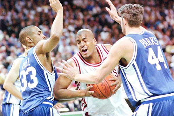 Duke's Grant Hill, left, and Cherokee Parks, right, try to contain Arkansas' Corliss Williamson during the first half of the NCAA championship game in Charlotte, N.C., Monday, April 4, 1994. (AP Photo/David Longstreath)