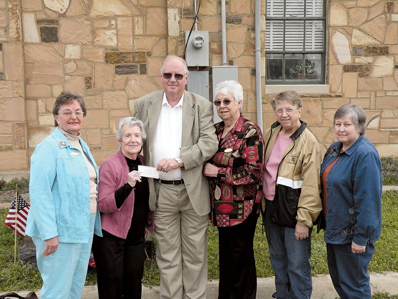The Maria Van Buren Chapter of the National Society Daughters of the American Revolution in Clinton has donated $100 to purchase four knockout rose bushes to be planted at the Van Buren County Courthouse in Clinton. Presenting the check to Van Buren County Judge Roger Hooper, center, are, from left, Carolyn Marshall, chapter regent; Virginia Kelley, chapter treasurer; Alice George, chapter vice regent; Janie Fullilove, chapter chaplain; and Diane Hall, chapter historian. Members of the Van Buren County Master Gardeners will install the rose bushes, along with other new plants, on the courthouse grounds.