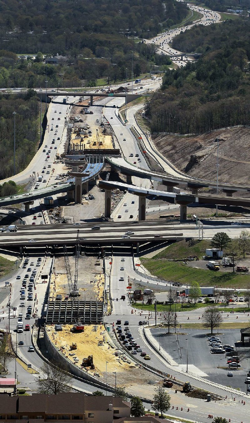 Arkansas Democrat-Gazette/BENJAMIN KRAIN --04/4/14--
Looking East - Construction continues on the Big Rock Interchange between Insterstate 430 and 630. The plans call for an addition of an overpass carring traffic from the end of Interstate 630 over Shackleford Rd and onto Financial Center Parkway, pictured at bottom.