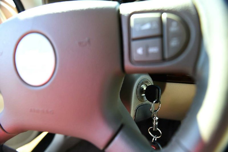 The ignition switch of a 2005 Chevrolet Cobalt is photographed in Alexandria, Va., Tuesday, April 1, 2014. General Motors CEO Mary Barra testified on Capitol Hill Tuesday about safety defects and mishandled recall of 2.6 million small cars with a faulty ignition switch that's been linked to 13 deaths and dozen of crashes. (AP Photo/Molly Riley)