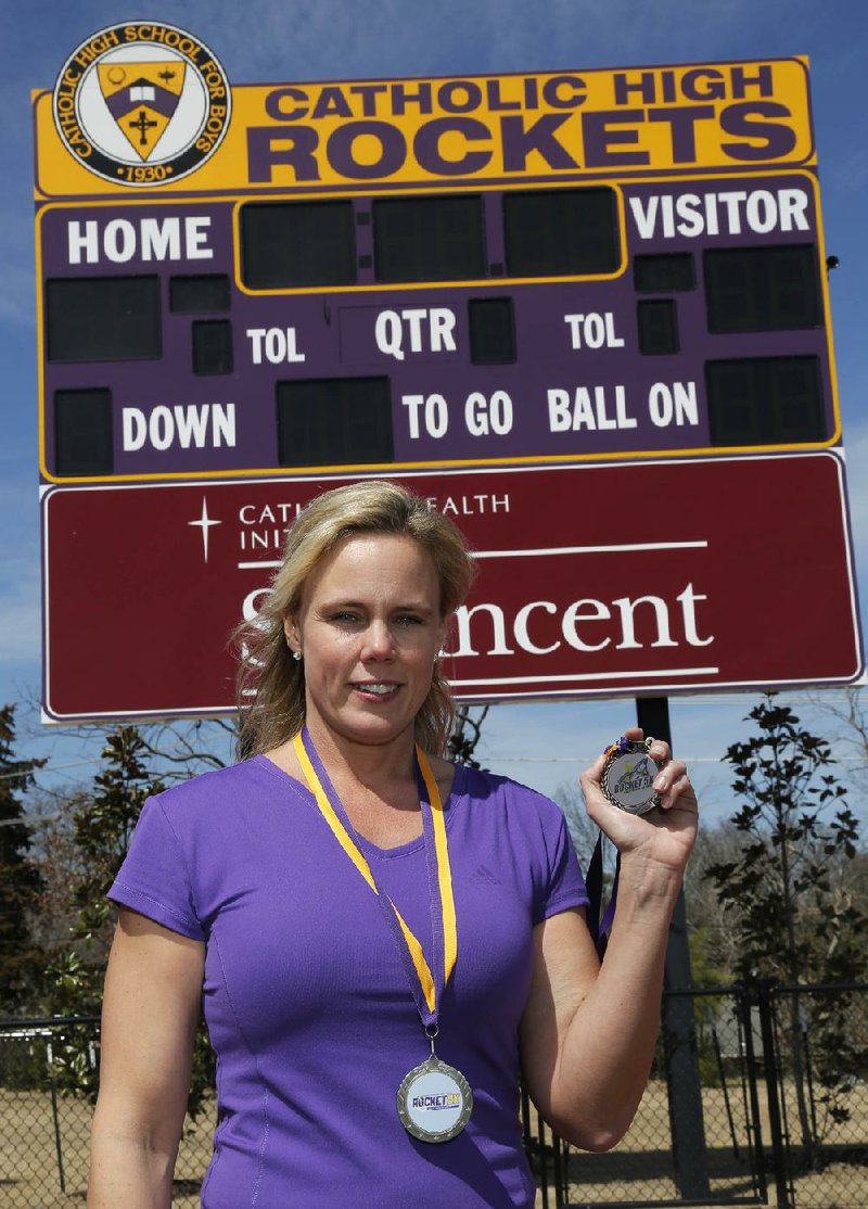 Arkansas Democrat-Gazette/JOHN SYKES JR - HIGH PROFILE VOLUNTEER - Shannon Wooley, chairman of this year's Rocket 5K Run, a fundraiser for Catholic High. 031814