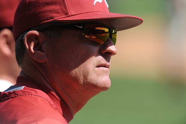 Arkansas coach Dave Van Horn watches from the dugout during play against South Carolina Friday, April 4, 2014, at Baum Stadium in Fayetteville.