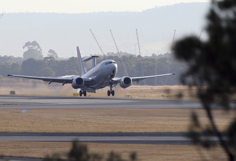 A Royal Australian Air Force E-7A Wedgetail takes off from Perth Airport to take part in search operations for the missing Malaysia Airlines Flight MH370 in Perth, Australia, Saturday, April 5, 2014. The air and sea search has not turned up any wreckage from the Boeing 777 that could lead searchers to the plane and perhaps its flight data and cockpit voice recorders, or "black boxes."