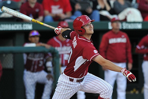 University of Arkansas batter Joe Serrano connects for a base hit with the basses loaded to drive in 3 runs in the second inning of the Saturday, April 5, 2014, game against South Carolina at Baum Stadium in Fayetteville.