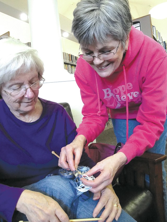 Vicky Hastings, left, and Joan Abrams put their heads together to perfect a scarf project at a recent Knitting Club meeting at the Bella Vista Public Library. This twice-monthly program meets at 2 p.m. on the first and third Tuesdays. Beginners will be guided by experienced knitters. Participants must bring their own supplies. For information, check the Bella Vista Library&#8217;s website at www.bvpl.org or call (479) 855-1753.