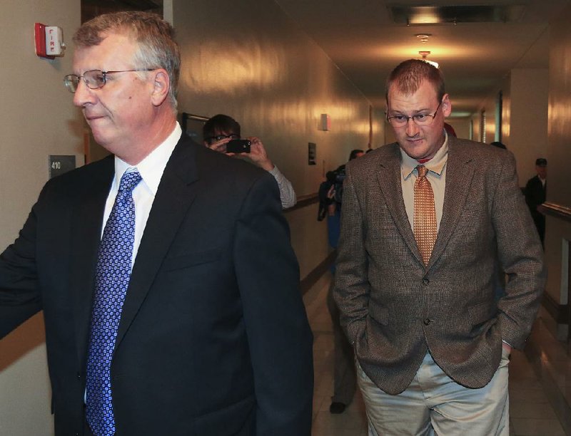 Arkansas Democrat-Gazette/RICK MCFARLAND --04/07/14--  Little Rock Police Cpt. Terry Hastings (left) and his son Josh Hastings, a former LRPD officer, enter Judge Wendell Griffen's courtroom where a short time later all charges against Josh Hastings were dropped in Little Rock Monday. Hastings had two manslaughter trials that ended in mistrials regarding the shooting death of 15-year-old Bobby Joe "Weedy" Moore III in August 2012. 