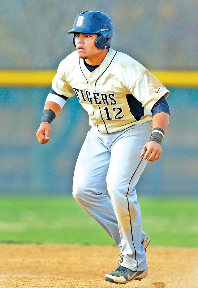 STAFF PHOTO JASON IVESTER Will Jibas of Bentonville takes a lead off second base April 1 against Rogers Heritage at Veterans Park in Rogers.