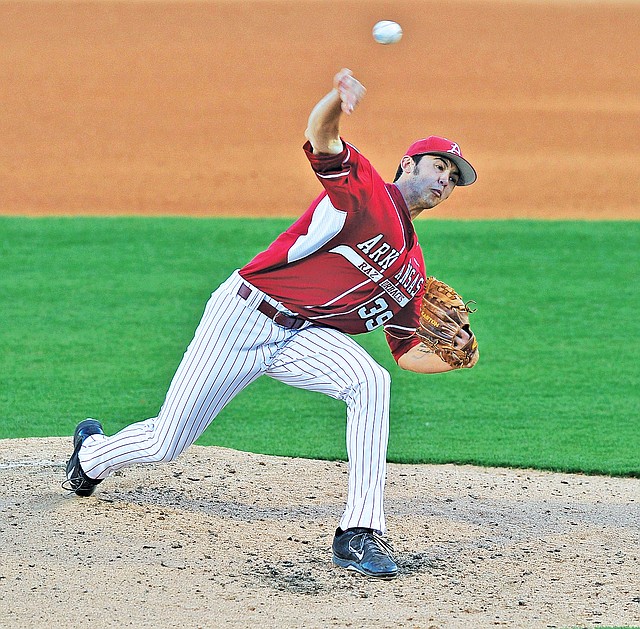 Staff Photo Michael Woods • @NWAMICHAELW Chris Oliver, Arkansas pitcher, fires a pitch Saturday in the fourth inning against South Carolina at Baum Stadium in Fayetteville. Oliver, a former Shiloh Christian standout, earned the win in Arkansas' 7-0 victory over the No. 1 Gamecocks.