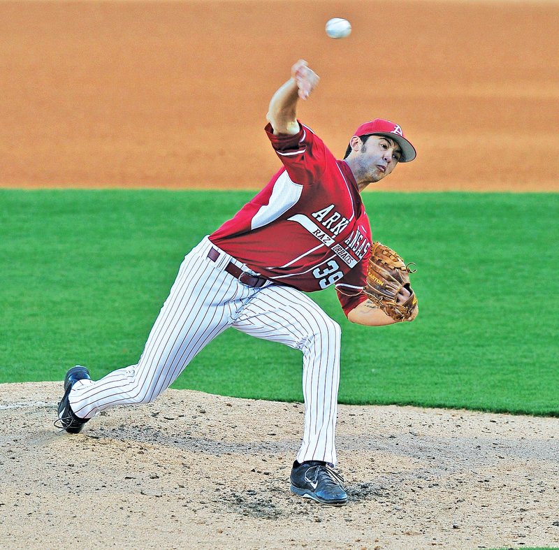 Staff Photo Michael Woods • @NWAMICHAELW Chris Oliver, Arkansas pitcher, fires a pitch Saturday in the fourth inning against South Carolina at Baum Stadium in Fayetteville. Oliver, a former Shiloh Christian standout, earned the win in Arkansas' 7-0 victory over the No. 1 Gamecocks.