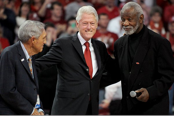 Eddie Sutton, President Bill Clinton and Nolan Richardson take part in a half-time ceremony in the game between Arkansas and LSU on Saturday, Feb. 15, 2014 in Bud Walton Arena in Fayetteville. 