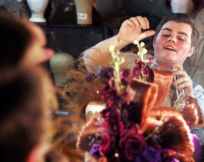 Rob Pickens of Little Rock, 18-year-old wig-maker for the Arkansas Repertory Theatre’s recent production of Les Miserables, designed and maintained some 50 wigs for the production, including this over-the-top, wedding-crashing wig of the character Madame Thenardier. The work required a lot of love, maintenance … and, yes, hairspray. 