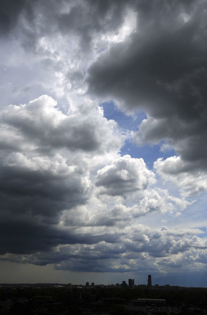 Clouds approach downtown Little Rock from the north as rain and strong winds associated with a cold front moving through Arkansas continued Tuesday afternoon. 